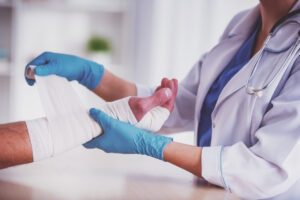 doctor tends to injured hand